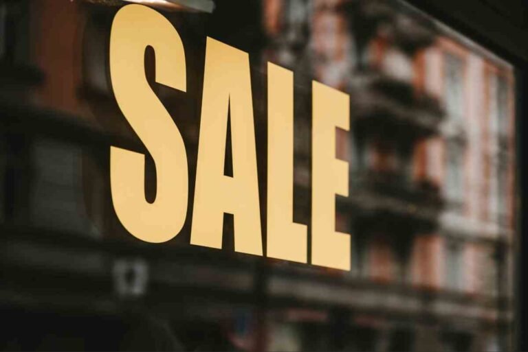 Yellow SALE sign on a shop window showing how to Build Trust New Ecommerce Store customers with clear offers