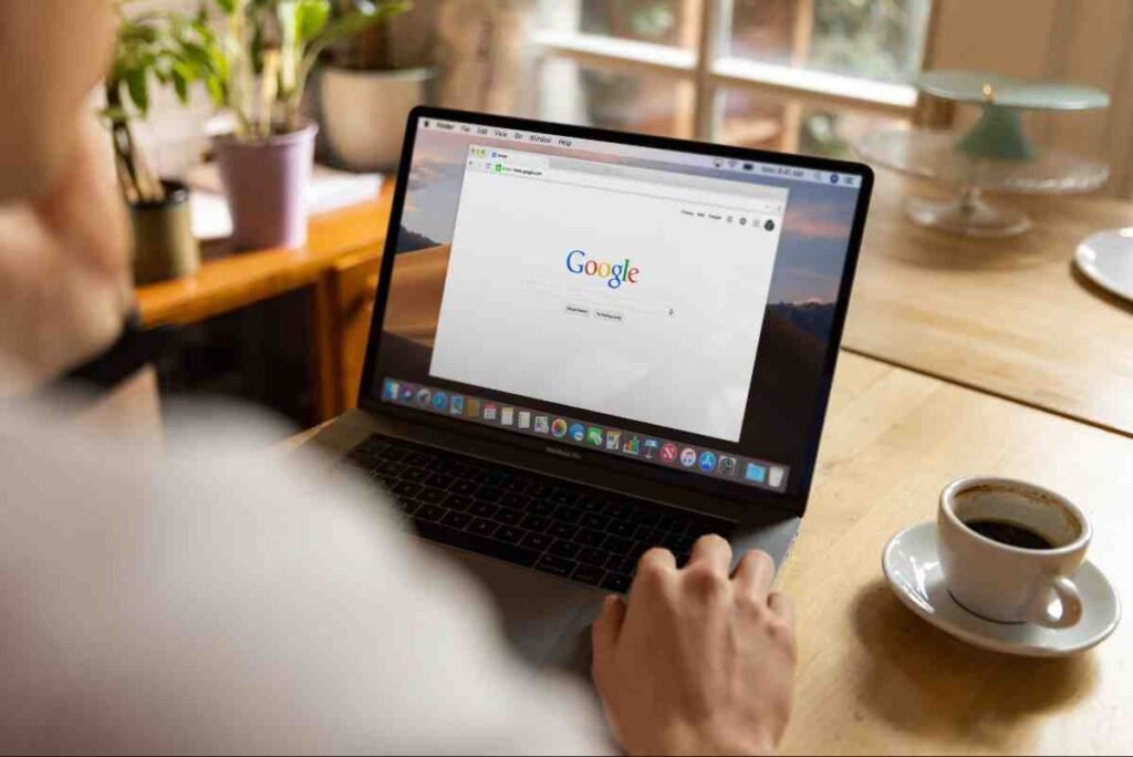 Person using a laptop with the Google homepage open to start keyword research for beginners