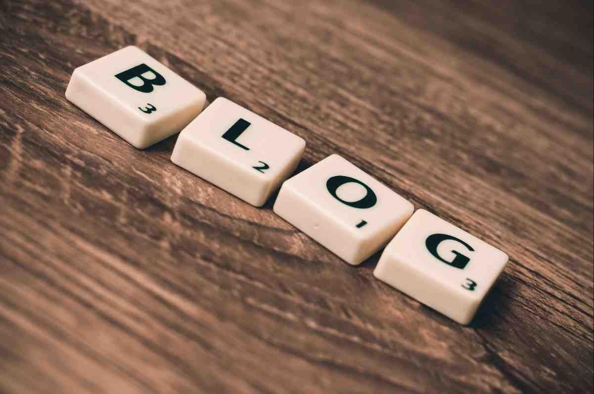 How to write SEO friendly blog posts: white letter tiles spelling BLOG on a wooden table