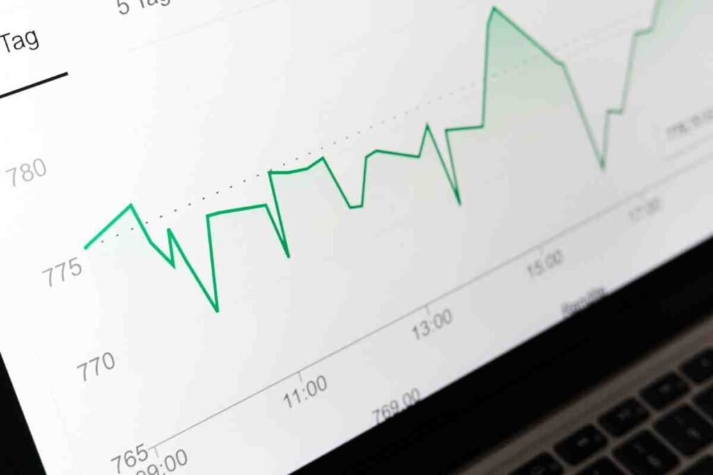 Green line graph on a laptop screen showing performance trends over time to improve Core Web Vitals on your site